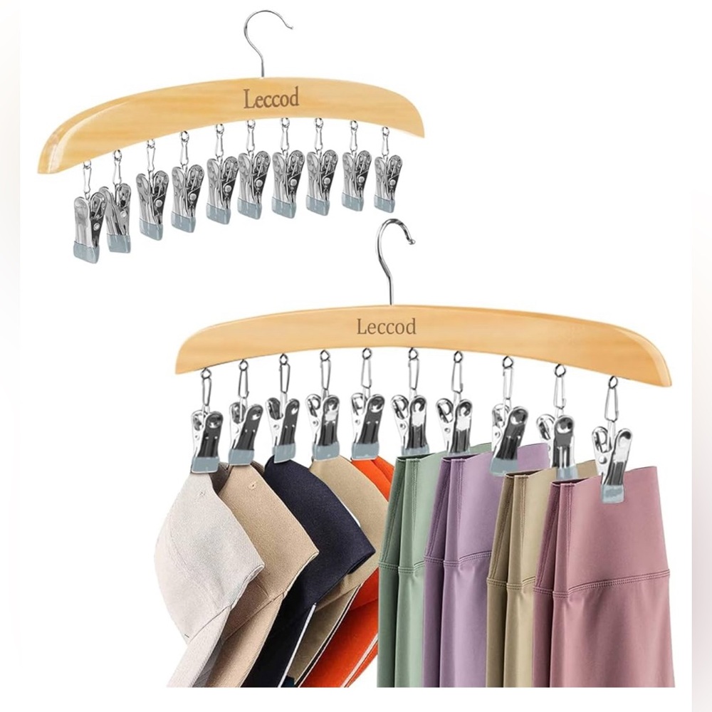Wooden hanger with metal clips for closet organization